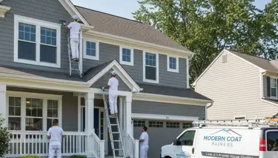 Professional house painters in Naperville IL painting exterior siding of a suburban home